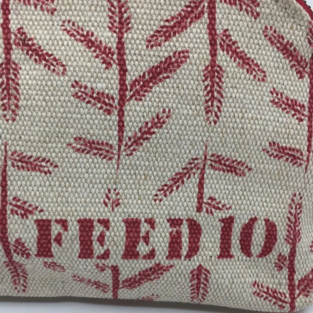 FEED 10 Clarins makeup cosmetics light tan and red carry-all pouch